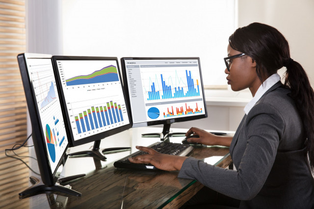 Woman at computer monitors